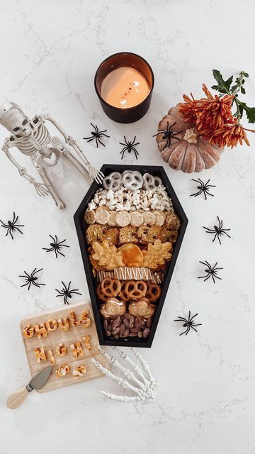 jeaneen | valentine’s day.home decor.charcuterie.entertaining on Instagram: "Coffin Tray Charcuterie for a Ghouls Night In ~ Or to share with your Boo! 👻 • No tricks, just treats please!! For more fun halloween food creations, check out these mamas: @janinehallknotslifemom @ohsoduckydesign @somethingmotherhood @heartsongpress @home.with.jeaneen @nataliealexandra7 @petitelittleseveryday @prettypartystudioco @inspo.by.sisters @thebeedegirls @alicianyanez @pockets.of.sweetness @ourho Ghouls Night Decor, Spooky Ladies Night, Halloween Girls Night Decorations, Halloween Ghouls Night, Girls Halloween Night In, Diy Coffin Charcuterie Board, Boocuterie Board, Halloween Girls Night In, Ghouls Night In