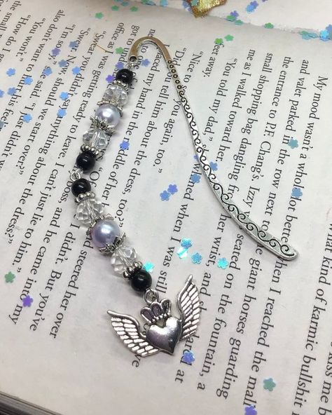 This bookmark includes: - antique silver charm - assorted beads!! PLEASE NOTE: - All of our bookmarks can be customized with different bases, charms or beads. - Every bookmark is handmade and may vary slightly from picture. - If you need more bookmarks than the stated quantity, please contact me. Bead Bookmarks, Bookmark Aesthetic, Beaded Objects, Charm Bookmark, Bookmark Ideas, Craft Stalls, Beaded Bookmarks, Heart With Wings, Book Marks