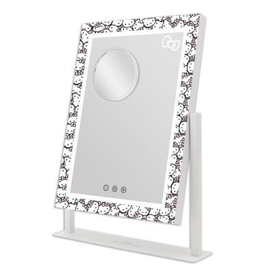 Impressions Vanity presents the Hello Kitty Tri Tone LED Makeup Mirror, a mirror that is energetic and bright just like the beloved Hello Kitty! Fit this ultra slim and super cute makeup mirror with lights anywhere, featuring an all over Hello Kitty print! Equipped with strip LED lighting around the makeup vanity with lights for even glow. Tap the power button of this smart mirror to turn it on/off and hold to adjust the brightness to your perfect level. Tap the right button to switch between na Hello Kitty Fit, Hello Kitty Print, Makeup Vanity Lighting, Hello Kitty Cute, Hello Kitty Makeup, Impressions Vanity, Catchall Tray, Smart Mirror, Big Mirror