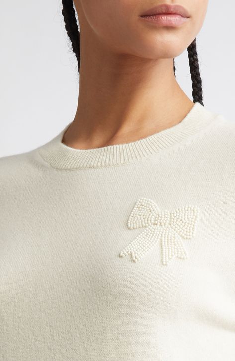 A beaded bow sweetens a classic wool sweater that's both prim and playful—a specialty of this Japanese brand known for inventive juxtapositions. 23" length Crewneck Long sleeves Ribbed cuffs and hem 100% wool Dry clean Made in Japan Designer Clothing Asian & Pacific Islander Owned/Founded Beaded Bow, Pacific Islander, Beaded Sweater, Fabric Gift Bags, Fabric Gifts, Free Fabric, Comme Des Garcons, Crewneck Sweater, Wool Sweater