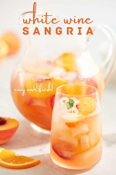 If you like a light and refreshing drink, then try this White Wine Sangria Peach recipe. This sangria has a surprising twist of a sparkling white wine that's flavored with peaches. And to elevate this cocktail add plenty of fresh peaches to the drink. Boston Pizza White Sangria Recipe, Sangria With Brandy Recipe, Spring Sangria Recipes White Wines, White Sangria Recipe For A Crowd Parties, Prosecco Sangria Recipes, White Sangria Recipe Easy Summer, Peach Sangria Recipes Easy, White Sangria Recipe Peach, White Sangria Recipe For A Crowd