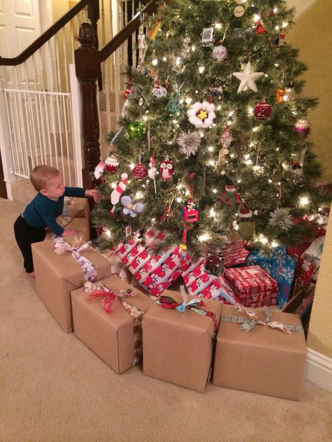 Fake-present barricade (ie...wrapped diaper boxes filled with books) prevents my 9 month old baby from getting under the Christmas tree. I put it far enough out that he can only reach a few baby friendly ornaments. Baby Friendly Christmas Tree, Christmas Tree Barrier For Kids, Fake Presents Under Tree, Baby Proof Christmas Tree, Toddler Proof Christmas Tree, Childproof Christmas Tree, Christmas Gifts Under Tree, Kid Friendly Christmas Tree, Christmas Present Decorations