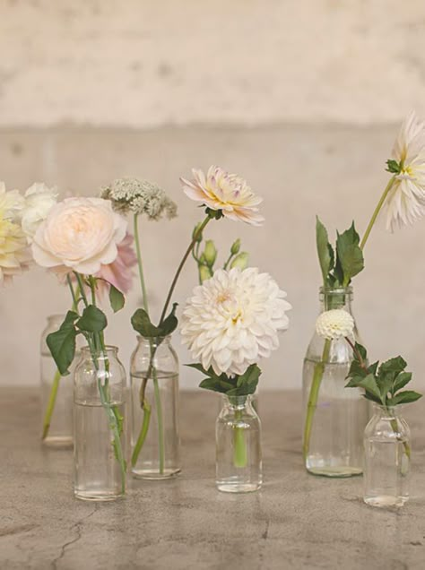 little bud vases placed in the centre of the table around the copper lantern in tones of white and  blush Glass Vase Wedding Centerpieces, Bud Vase Centerpiece, Spring Vases, Wedding Vase Centerpieces, Wedding Floral Centerpieces, Flower Vase Arrangements, Flower Arrangements Simple, Wedding Table Flowers, Wedding Vases