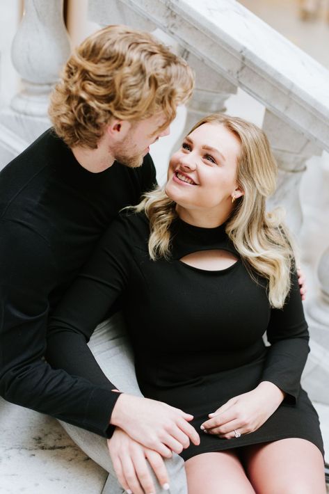 Utah based wedding and engagement photographer captures a stunning and elegant engagement session at the Utah State Capitol Building. Showing the couple posing in the grand staircase, at the top of the stairs, in front of the windows, and outside along the pillars.  #utahengagementphotographer #utahweddingphotographer #utahstatecapitolbuilding #engagementoutfitideas #coupleposingideas Couple Stairs Poses, Couple Photo On Stairs, Couples On Stairs, Couples Sitting On Stairs, Couple On Stairs, Pictures On Stairs, Romantic Couple Poses, Top Of The Stairs, Capitol Building