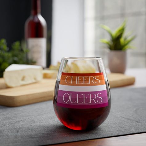 Raise a toast to love and equality with our Lesbian Bachelorette Party Wine Glass! This elegant glass features the phrase 'Cheers Queers,' making it perfect for bachelorette parties, weddings, and pride celebrations. Made from high-quality glass, it's durable. Add a touch of pride to your special day with this beautiful wine glass! #lesbian #gay #lgbtq #lesbianbachelorette #bachelorette Lesbian Bachelorette Party Ideas, Lesbian Bachelorette Party, Lesbian Bachelorette, Wine Bachelorette Party, Bachelorette Party Themes, Wine Parties, Bachelorette Parties, Wine Glasses, Bachelorette Party