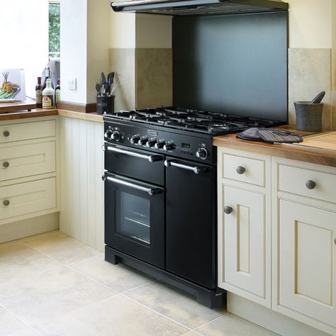 Cream kitchen, black oven, wooden work tops, country kitchen Double Cooker Kitchen, Kitchen Ideas With Range Cooker, Cream Kitchen Black Appliances, Cream Cabinets Black Appliances, Black Range Kitchen, Kitchen Cream And Black, Rangemaster Cooker Kitchen, Black Oven Kitchen, Black Stove Kitchen