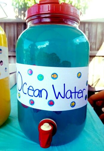 Ocean water for ocean or beach themed birthday parties! Everyone loved it. Ingredients: Blue Hawaiian Punch Lemonade You can also add some sprite if you like. I didn't measure anything out, I just did it to taste. We had children at the party so no alcohol was in this drink, but it also goes great with vodka for the adults! Birthday Beach Theme Decorations, 50th Birthday Ocean Theme, Ocean Themed Party Snacks, Beach Birthday Party Games, Bora Bora Themed Party, Bluey Birthday Beach Party, Beach Theam Birthday Party, Beach Theme Birthday Party For Teens, Spongebob Drinks Alcohol