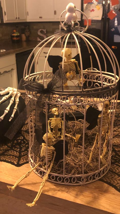 Caged Skeleton, Diy Mini Skeleton Decor, Mini Skeleton Decorations, Mini Skeleton Ideas, Mini Skeleton Crafts, Skeleton Fairies, Skeleton Fairy, Halloween Bottle Labels, Scary Halloween Decorations Outdoor