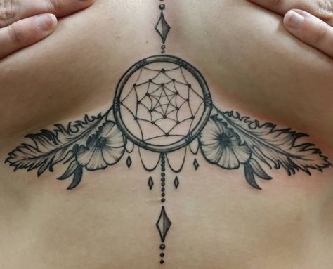 Dreamcatcher Sternum Tattoo | Tattoo Ideas and Inspiration Dreamcatcher Chest Tattoo Female, Dream Catcher Tattoo Under Brest, Dainty Dream Catcher Tattoo, Western Sternum Tattoo, Womens Sternum Tattoo Ideas, Unique Sternum Tattoo Women, Underbreast Tattoo Unique, Sternum Tattoo Design Unique, Feminine Sternum Tattoo