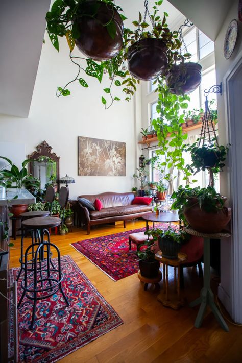 Plant-Filled Brooklyn Apartment Tour Photos | Apartment Therapy West Elm Living Room, Ikea Headboard, Lots Of Plants, Brooklyn Apartment, Gold Frame Wall, Living Room Plants, Living Room Red, Red Chair, Room With Plants