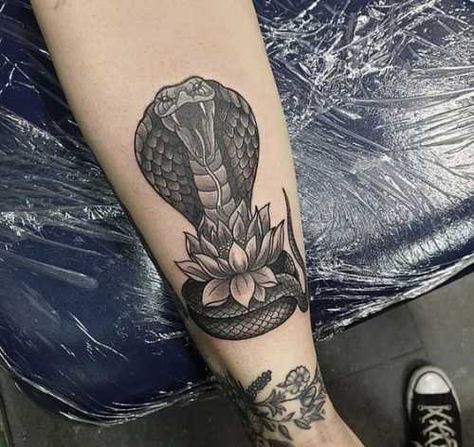 29 Snake and Flower Tattoos Ideas: A Harmonious Fusion of Nature and Serpent Cobra Tattoo Women, King Cobra Tattoo Design, Snake Cover Up Tattoo, Snake Calf Tattoo, Snake And Flower Tattoo, Tattoo Around Arm, King Cobra Tattoo, Flower Tattoos Ideas, Buddhism Tattoo