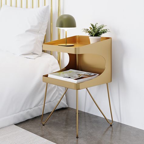 - This nightstand will provide a streamlined, modern look to the living room or den while also adding an industrial flavor. This table is built entirely of solid metal, which gives it a reclaimed appearance. - The whole body of this side table is treated in golden metal, which is a royal hue of refinement that lends it a beautiful, contemporary appearance. - The bottom shelf is wonderful for displaying framed photographs or fanning out editions of the favorite magazines and other peripherals and Modern Metal Nightstand, Gold Bedside Table, Brass Nightstand, Gold Nightstand, Metal Nightstand, Gold Side Table, Bedside Table Storage, Bedroom Bedside Table, 2 Shelves