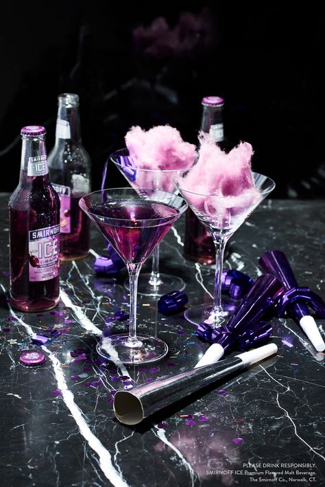 “Whoa.” That’s what your friends will say when they see these fluffy purple puffs of heaven. So huddle up on NYE at midnight and ring in the New Year with a round of easy and deliciously sweet cotton candy cocktails, the perfect way to kick off 2017.   Countdown Cocktail Recipe: Pour 1 Smirnoff ICE Grape over cotton candy Purple Cotton Candy, Cotton Candy Drinks, Cotton Candy Cocktail, Cotton Candy Grapes, Lila Party, Cotton Candy Champagne, New Years Cocktails, Mocktail Drinks, Purple Cocktails