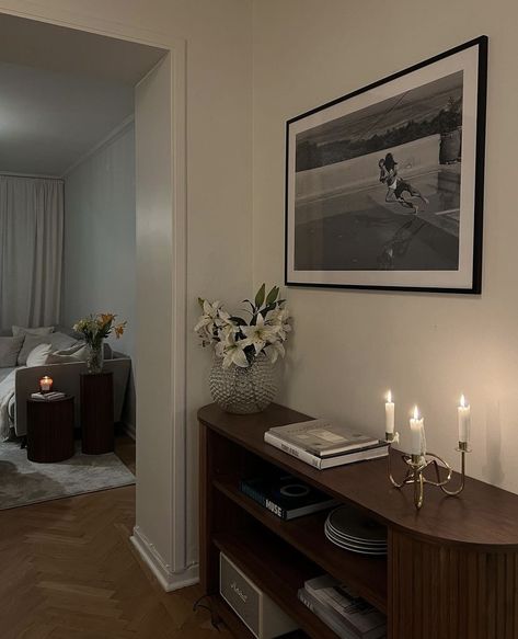 Couch In Center Of Room, Decorating Around A Radiator, Armchair Bedroom Aesthetic, City Chic Apartment, Cocktail Room Ideas, Midcentury Modern Apartment Aesthetic, Dark Wood Apartment Decor, Nyc Studio Apartment Layout, Nightstand Decor With Lamp