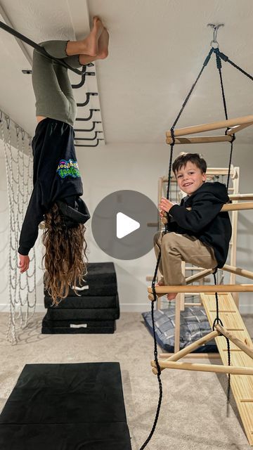 Emily Russo | Content creator on Instagram: "The monkey bar phase of our playroom is finally finished! 👏🏻 I cannot tell you how big of a hit these have been, we have had over a dozen kids over in the last few weeks and we could hardly pry them out of the basement. 😂  One of the best things about the addition of monkey bars is that you can scale up your playroom without losing any floor space! Whether you have a large playroom or smaller adding monkey bars creates a lot of opportunities for creative play! The @projectplayrooms bars are incredible quality and their customer service is top notch. If you’re looking to expand your kiddos play area they have a ton of fun products!   #projectplayroom #playroominspiration #grossmotorskills #grossmotorplay #creativeplay #monkeybars #playroominte Ceiling Monkey Bars, Diy Active Playroom, Playroom Monkey Bars, Active Playroom, Large Playroom, Indoor Monkey Bars, Indoor Playroom, Monkey Bar, Kids Indoor Playground