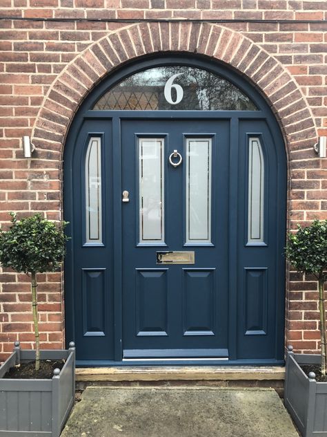 Brown House With Blue Door, 1930s Front Door Porch Arch, Hague Blue Front Door Farrow Ball, 1930s Arched Front Door, Blue Front Door Brick House, Hague Blue Front Door, Navy Blue Front Door, Farrow And Ball Hague Blue, Arched Exterior Doors