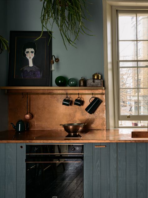 Helen Parker, the creative director at Devol, whose kitchen range includes copper worktops, sinks and splashbacks, says, “Copper looks rare and precious, and turns out to have amazing antibacterial properties, which now make it even more desirable. What a special product it has turned out to be, so glamorously chic and a little bohemian, with the power to kill pathogens in minutes.” Featured here, bespoke copper top and splashback in a Sebastian Cox kitchen, from £15,000; devolkitchens.co.uk Copper Kitchen Backsplash, Kitchen Credenza, Farmhouse Kitchen Backsplash, Copper Backsplash, Unique Backsplash, Devol Kitchens, Copper Kitchen, Chic Kitchen, Kitchen Trends