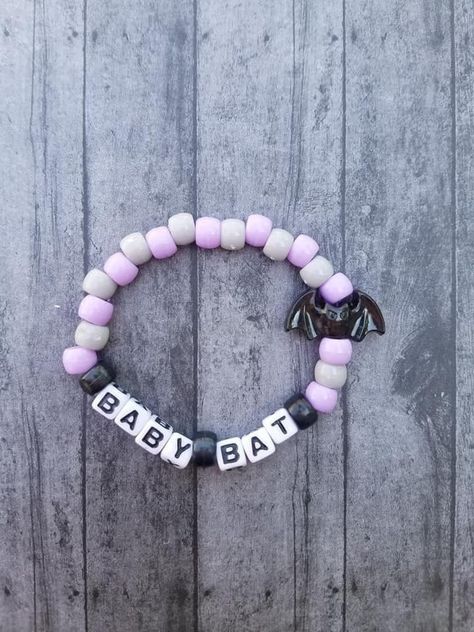 Once upon a time we were all baby bats..or perhaps the time is now! This cute Baby Bat beaded bracelet is a perfect accessory for yourself, a loved one, or a special gift for a gothy bff! Primary colors used: black, pale grey, pastel purple Made with pony beads on a stretch cord. Each bracelet is approximately 7.5 inches around but can be adjusted to other lengths if needed. Just send me a message with the length required at the time of purchase and I'd be happy to make the adjustment. Want to o Halloween Kandi, Baby Bats, Kandi Bracelets, Time Is Now, The Time Is Now, Pastel Purple, Pony Beads, Pastel Goth, Special Gift