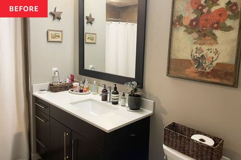 Plant and toiletries atop white sink with dark brown cabinet in bathroom with floral art on beige wall and basket for toilet paper. Sanctuary Apartment, Rental Bathroom Makeover, Lake Bathroom, Spa Like Bathrooms, Gold Cabinet Pulls, Dark Brown Cabinets, Rental Bathroom, Ideal House, Kohler Faucet