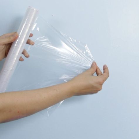 We had no idea you could do this with plastic wrap & glue, but it's actually brilliant Fix Hole In Wall, Fill Nail Holes, Patch Hole, Pvc Trim, Nail Repair, Home Fix, White Glue, Nail Holes, Diy Home Repair