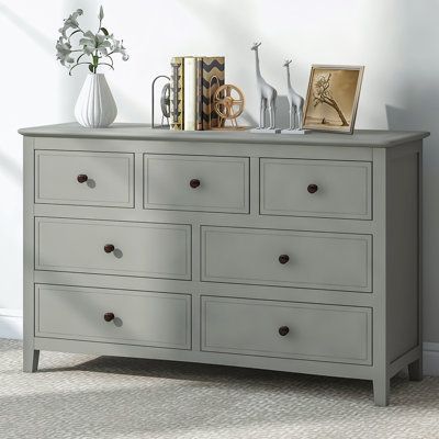 This chic dresser, made from sturdy pine solids and MDF boards, is a combination of style and functionality. It comes with ample storage space to hold a variety of items, from clothes to accessories. The piece features brushed nickel hooded pulls, solid tapered wood legs that add a touch of sophistication, and a paint-coated, water-resistant surface for longevity and easy maintenance. Its classic color effortlessly complements your existing furniture, bringing a pleasing visual experience to you Dresser Grey, Storage Solutions Bedroom, Solid Wood Dresser, 7 Drawer Dresser, Accent Chests And Cabinets, Accent Storage, Teen Bedroom Furniture, Wood Dresser, Bedroom Furniture For Sale