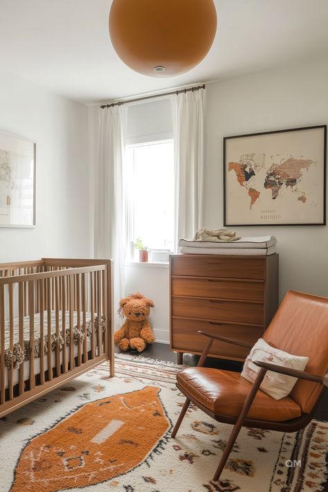 Elegant nursery with natural tones, mixed wood furniture, map accent wall, and cozy rug. Perfect for nursery inspiration and cozy nursery ideas. Mid Century Modern Nursery Neutral, Mid Century Baby Room, Mid Century Modern Baby Nursery, Midcentury Modern Nursery Ideas, Mid Century Nursery Boy, Nursery Office Combo, Mcm Nursery, Mid Century Baby, Ergonomic Furniture