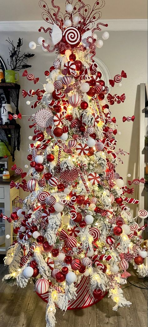 Christmas Decor Ideas Candy Cane Theme, Decorated Candy Canes, Candy Cane Theme Tree, Red And White Candy Cane Christmas Tree, Candy Cane Christmas Trees, Flocked Christmas Tree Themes, Christmas Tree Candy Cane Theme, Candy Cane Theme Christmas Tree, Candy Cane Christmas Tree Theme