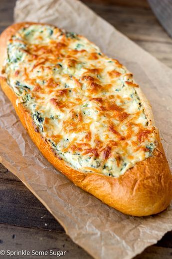 Crispy, crusty french bread gets filled with an extra creamy spinach and artichoke dip. - Spinach and Artichoke Stuffed Bread Crusty French Bread, Artichoke Stuffed, Spinach And Artichoke Dip, Stuffed Bread, Cheesy Bread, Bread Appetizers, Creamy Spinach, Artichoke Dip, Bread Bowls