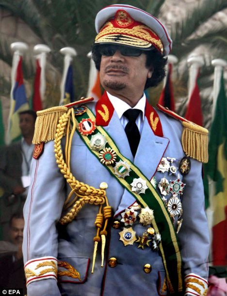 Heavily decorated: Gaddafi pictured in an ostentatious military uniform in 2009, watching a parade to mark the 40th Anniversary of the Libyan Revolution African Dictators, Ventriloquist Doll, Muammar Gaddafi, African Royalty, Shocking News, Arabian Nights, African History, Libya, Military Uniform