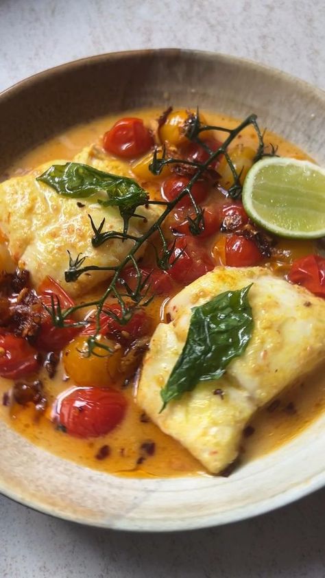 Tomato and coconut broth, inspired by my favourite fish curries. I used wild caught cod here but you can substitute this with a firm white fish. This is a perfect quick dinner recipe and the flavours of turmeric, coconut, and fresh herbs like basil and cilantro stalks truly sing! Recipe ag the link Poached Cod, Vine Tomatoes, Poached Fish, Cod Fillets, Cod Fish Recipes, White Fish Recipes, Fish Dinner Recipes, Garlic And Ginger, Chilli Oil