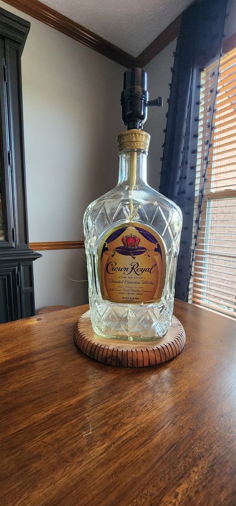 One of a kind hand made Crown Royal Whiskey Bottle Lamp. Bulb not included. Crown Royal Bottle Crafts Diy Halloween, Crown Bottle Crafts Diy, Crown Royal Bottle Crafts Diy, Whiskey Bottle Lamp, Upcycle Bottles, Crown Royal Whiskey, Crown Royal Bottle, Crown Bottle, Liquor Bottle Crafts