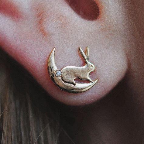 Please allow 6 weeks for production and delivery. To inquire about availability, please contact us at orders@magpiejewellery.com. Description: Whimsical and ever playful, these tiny earrings are the sweetest thing you'll ever set your eyes on!These baby bunnies sit on the tiniest crescent moons with diamond tails. The crescent moon phase hugs your earlobe ever so perfectly. Charming and sweet. Made by hand in the Montreal studio of Sofia Zakia. Details: Materials: 14K Yellow Gold Stones: 1mm Whi Moon Bunny, Quirky Accessories, Sofia Zakia, Moon Earring, Little Earrings, The Sweetest Thing, Bunny Earrings, Sweetest Thing, Tiny Earrings