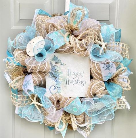 Bring the beach into your home this holiday season with these DIY coastal Christmas decorations. From coastal christmas wreaths to coastal Christmas trees, there are plenty of beach themed DIY christmas decor ideas to choose from. These nautical christmas decorations make great christmas crafts too! Coastal Christmas Decorations, Beachy Christmas Tree, Burlap Ribbon Wreaths, Beach Christmas Trees, Beach House Coastal, Christmas Deco Mesh, Beach Christmas Decorations, Driftwood Christmas Tree, Coastal Christmas Tree