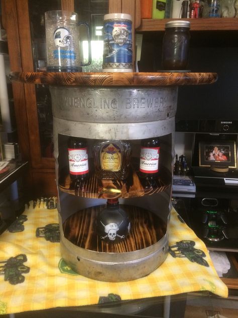 Liquor cabinet / bar / side table that I made out of an old Yuengling Keg.  I got the idea from the wine barrel bars that I have seen, but I hadn't seen any that had been made from a keg.  So I decided to give it a shot.  DIY Keg Bar! Keg Cabinet, Beer Kegs Repurposed, Beer Keg Ideas Projects, Ideas For Old Beer Kegs, Keg Table, Bar Made From Whiskey Barrels, Beer Keg Ideas, Liquor Cabinet Bar, Pallet Patio Furniture Diy