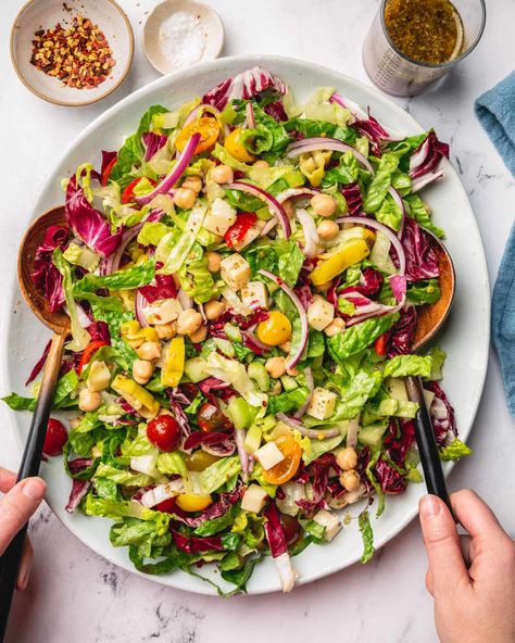 Vegetarian Italian Chopped Salad Credit: Photo: Shelly Westerhausen Credit: Photo: Shelly WesterhausenMy family has pizza night once a week. Some weeks we make pizza from scratch, other weeks we order delivery, and, yes, sometimes we put frozen pizzas into the oven and call it dinner. An excellent side dish or salad (and, let’s be honest, a nice glass of wine) can elevate any and all pizza nights just enough to make it feel like a nice meal you planned — rather than one that just sav Pizza Side Salad, Salad With Pizza Side, Best Salad To Serve With Pizza, Salad To Go With Ribs, Sides To Go With Pizza, Pizza Party Side Dishes, Salad With Pizza, What To Serve With Pizza, Pizza Side Dishes