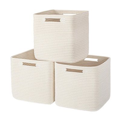 These hand-woven storage baskets have a spacious size of 10.5 x 10.5 x 11", providing plenty of room for items ranging from games and media accessories to clothing and hobbies. They are designed to fit cube storage organizers, bookshelf units and other shelves that are approximately 11.25-12" deep, this 3-pack of collapsible storage cubes is a smart choice for organizing and organizing your living space. | Rosecliff Heights Box - Set of 3 in Brown, Size 11.0 H x 10.5 W x 10.5 D in | Wayfair | Or Cute Shelves For Room, Natural Storage Cube, Cute Bins For Bedroom, Clothes Storage Bins, Cute Storage Containers, Aesthetic Things For Room, Room Accessories Aesthetic, Cute Decorations For Bedrooms, Cute Storage Bins