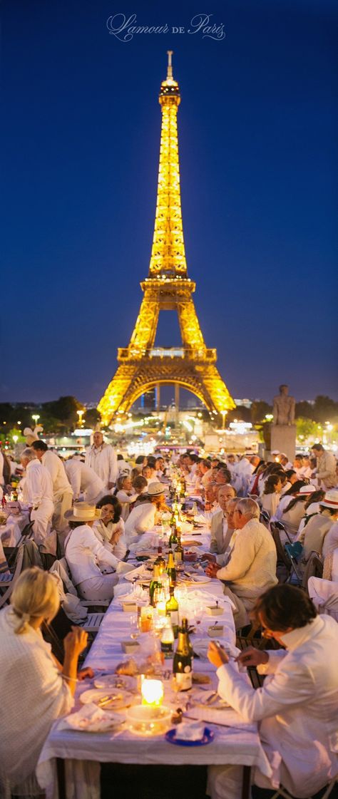 Diner en Blanc, a top secret invitiation-only flash mob in Paris, France where 11,000 people dressed entirely in white clothes spontaneously set up tables and chairs in front of historic landmarks one night a year. Photographed by Paris wedding and portrait photographer Stacy Reeves Torre Eiffel Paris, Historic Landmarks, Beautiful Paris, White Clothes, Flash Mob, Tables And Chairs, Paris City, Top Secret, One Night