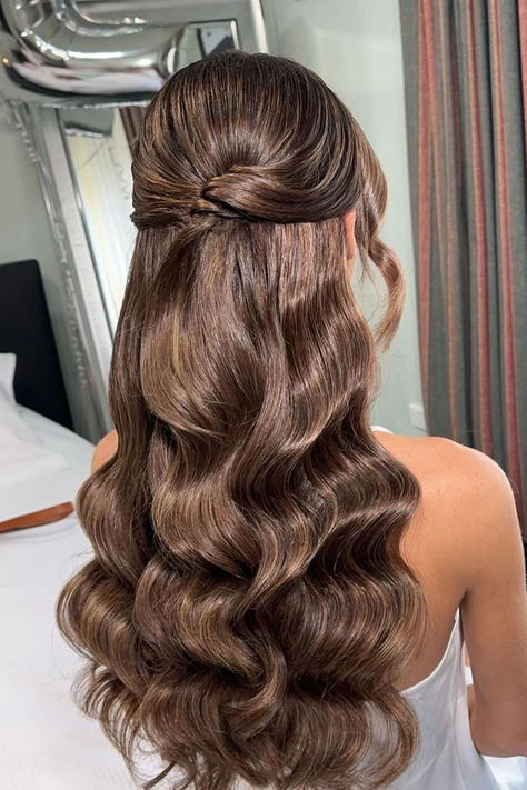 Chic and sophisticated half-updo featuring voluminous curls in luxurious chocolate brown tones, exuding elegance and charm for any special event. // Photo Credit: Instagram @kxhairdesign Half Updo Wedding Hairstyles, Wavy Half Updo Hairstyles, Half Up Half Down Wedding Hair Elegant, Long Curled Hair Half Up Half Down, Elegant Hairstyles For Graduation, Ball Hair Down, Half Up Half Down Wedding Hair Brown Long, Wedding Hair Wavy Half Up Half Down, Brown Wedding Hair Updo