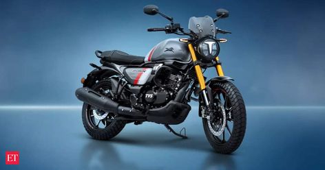 TVS Motor Company, a manufacturer of two-wheelers, revealed that their "modern-retro" motorcycle, the Ronin, will have a special edition version available for the holidays. One of the updates is a new graphic. It has three tones: grey for the main tone, white for the secondary tone, and a red stripe for the third tone on the side panel and tank. Mahindra Classic, Tvs Ronin, Tvs Motor Company, Enfield Bike, Bajaj Auto, Motorcycle Brands, Suzuki Motorcycle, Retro Motorcycle, Top Cars