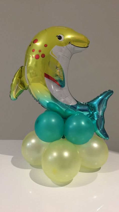 Balloon Centerpiece 5" balloons and 14" foil dolphin Balloon Dolphin, Balloon Centerpiece, 5 Balloons, Balloon Centerpieces, Under The Sea, Shower Ideas, Snow Globes, Globe, Foil