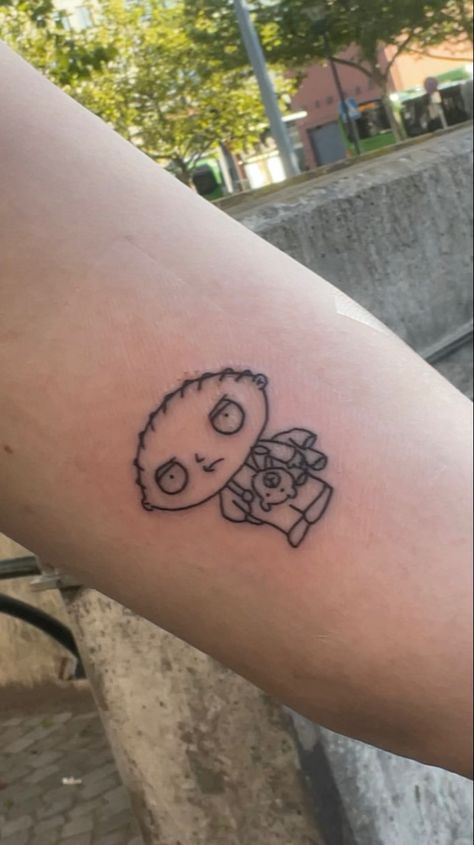 Stewie Griffin Tattoo Design, Family Guy Tattoo Design, Small Cartoon Tattoos For Men, Stewie Tattoo Ideas, Carton Tattoo Ideas, Family Guy Stewie Tattoo, Funny Cartoon Tattoos, Small Cartoon Tattoo Ideas, Cartoon Characters Tattoo Ideas