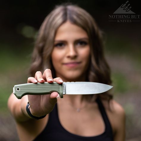 A young woman holding a survival knife in front of here. Tops Knives, Survival Knives, Tough Woman, Skinning Knife, Finger Guard, Kydex Sheath, Bushcraft Knives, Outdoor Knife, Edc Knife