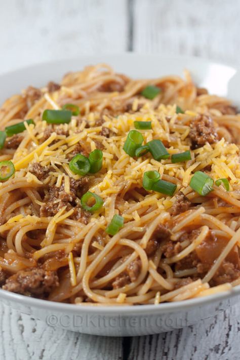 Slow Cooker Chili Spaghetti - Your favorite chili flavors mixed into a crock pot spaghetti recipe. It's made with ground beef, tomato juice, onions, chili powder, cheese, and spaghetti noodles. | CDKitchen.com Chilli With Spaghetti Noodles, Recipes With Tomato Juice In Them, Chili With Spaghetti Noodles, Tomato Juice Recipes Dinner, Recipes Using Tomato Juice, Hillbilly Chili, Chili Spaghetti Recipe, Cabana Recipes, Crockpot Sides