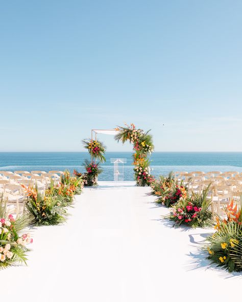 Say hello to our tropicool florals for this gorgeous Jewish wedding! The chuppah, adorned with pink, yellow, and orange blooms, offered a shelter for the couple to began their new journey. The reception was just as radiant, featuring fun floral arrangements in a similar color palette. WP: @delcaboweddings Decor: @yayarentals Venue: @jwloscabos Photo: @tarynbaxterphotographer #AriaVeraFloral #FloralDesign #TBT #JewishWedding #HuppahArrangements #Tropicool #SummerVibes #FloralInspo Fun Floral Arrangements, Tropical Colors, Miami Wedding, Jewish Wedding, New Journey, Pink Yellow, Say Hello, Summer Vibes, Floral Arrangements