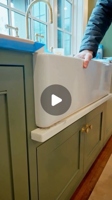 NS Builders on Instagram: "Apron sinks and water damage?  While there’s a lot to love about apron sinks, this style makes it easier for water to run down and ruin your cabinets below. This stone detail helps catch those drips and prevents that lower door from getting destroyed.  #nsb182 Architecture @stevetiek  Millwork @materiamillwork  Stone @metcabinet  Video @motifmediaco   #nsbuilders #builder #customhome #needham #countertops #stone #kitchendesign" River Kitchen Sink, Apron Front Countertop, Kitchen Sinks On Islands, Apron Sink With Towel Bar, Drip Rail Under Farmhouse Sink, Apron Sink Drip Ledge, Drip Rail Under Sink, Drip Edge Sink, Fireclay Sink Kitchen