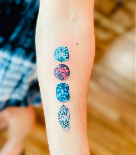 Gemstone tattoo, birthstone tattoo, jewelry tattoo, ruby, diamond, sapphire, aquamarine, realistic gemstone tattoo, tattoo, diamond tattoo, realism tattoo January Birthstone Tattoo, Aquamarine Tattoo Ideas, Gemstone Tattoo Realistic, Aquamarine Tattoo, Gemstone Tattoos, Birthstone Tattoo Ideas, Birthstone Tattoos, Sapphire Tattoo, Gemstone Tattoo