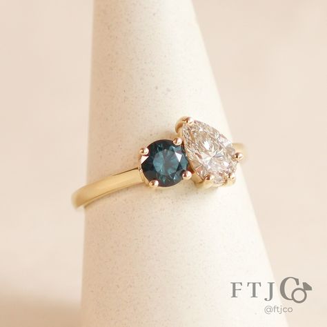 We are absolutely smitten with this luscious Toi et Moi ring 😍 It's such a great combo - the pear diamond has a warm blush-like flush, which pairs so beautifully with the deep teal Montana sapphire... all set in our buttery 18K yellow gold?! What more can we ask for!! This masterpiece was made for a very lucky client, so it isn't available for purchase... but if you're just as gobsmacked as us, please reach out, as we can make a similar ring just for you! 💎🍐💕 . This is a Toi et Moi Ring made ... Cute Engagement Rings, Montana Sapphire, Pear Diamond, Deep Teal, Montana, Pear, Engagement Ring, Sapphire, Blush