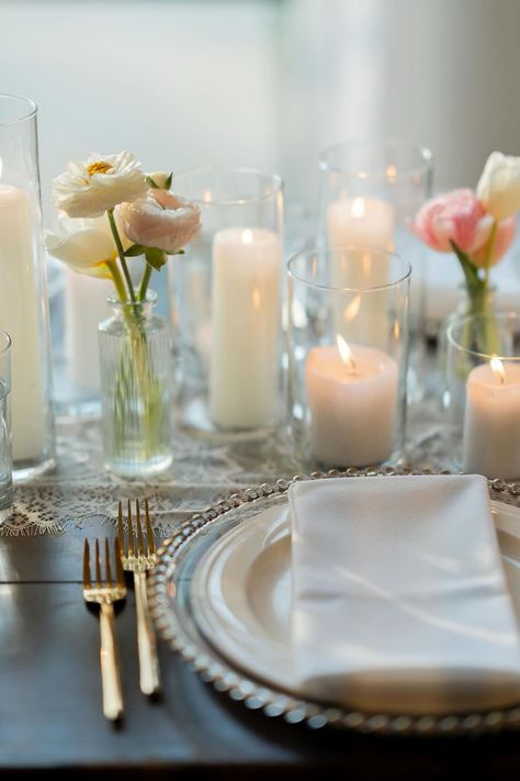 This reception!!!✨ The head tables were filled to the brim with candles and a few bud vases, and the other guest tables had a simpler version of this with centerpieces in gold vases for the rounds. We pivoted our design plan throughout this couples’ planning process to match their vintage-glam vibe and feature some of the brides favorite flowers, tulips. We opted for a mix of textured and clear glass bud vases, and some of our antique gold compotes to tie into the gold accents. 💫 Because I’... Clementine Decor, Tulip Wedding Theme, Round Table Centerpieces, Peach Wedding Theme, Cocktail Table Decor, Glass Bud Vases, Tulip Wedding, Wedding Table Designs, Head Tables