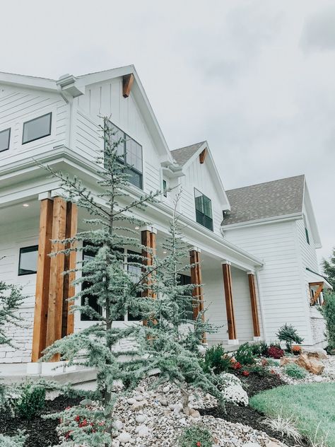 White House Landscaping Ideas, Bermuda House, White House Black Windows, Farmhouse Modern Decor, White Farmhouse Exterior, Front Landscape, Spruce Trees, Victoria House, Brown Tree