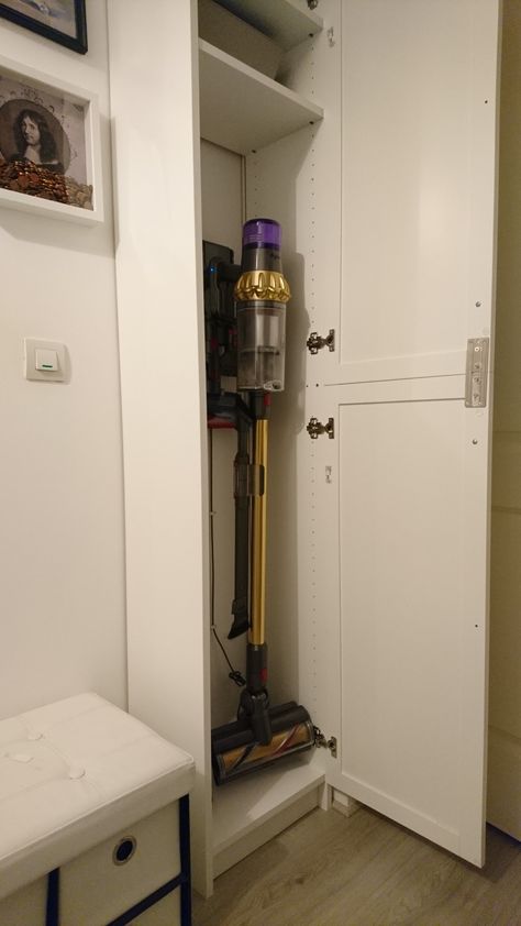 Ikea Hack. #ikeahacks Your Dyson vacuum fits into the smallest Ikea Billy Book case. Ikea Laundry Cupboard, Closet For Dyson, Dyson Hoover Storage, Ikea Hack Broom Closet, Entry Closet Organization Vacuum, Broom Closet Ikea, Vacuum Cleaner Storage Closet, Laundry Room Dyson Storage, Dyson Storage Cupboard